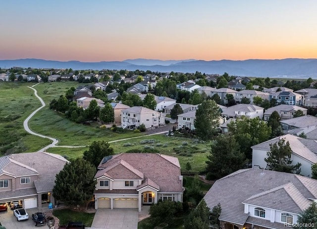 10085 Charissglen Ct, Highlands Ranch, CO 80126 - aerial view at dusk of a residential view and a mountain view