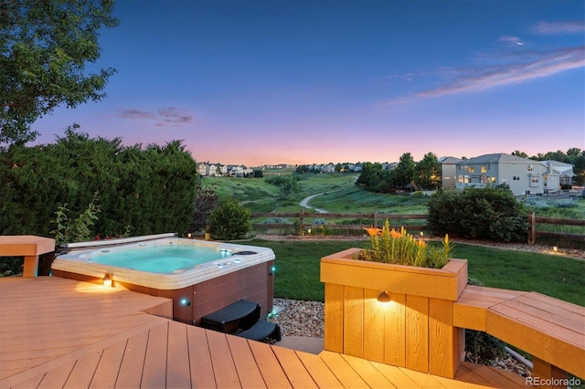 10085 Charissglen Ct, Highlands Ranch, CO 80126 - deck at dusk featuring an outdoor hot tub