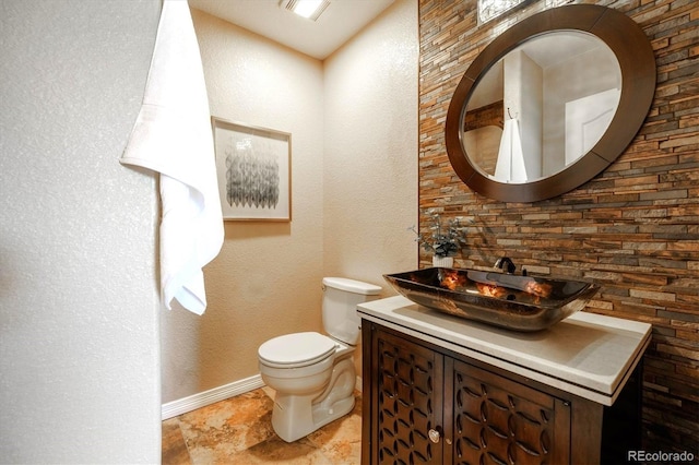 10085 Charissglen Ct, Highlands Ranch, CO 80126 - half bathroom featuring vanity and a textured wall