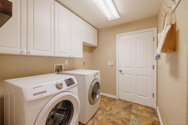 10085 Charissglen Ct, Highlands Ranch, CO 80126 - washroom with cabinet space, washing machine and clothes dryer, and light stone finish flooring