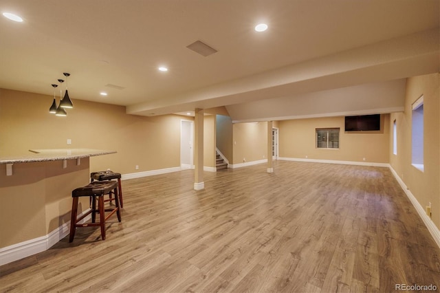 10085 Charissglen Ct, Highlands Ranch, CO 80126 - finished basement with light wood-type flooring, recessed lighting, and stairway