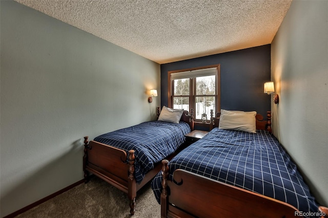 carpeted bedroom with a textured ceiling