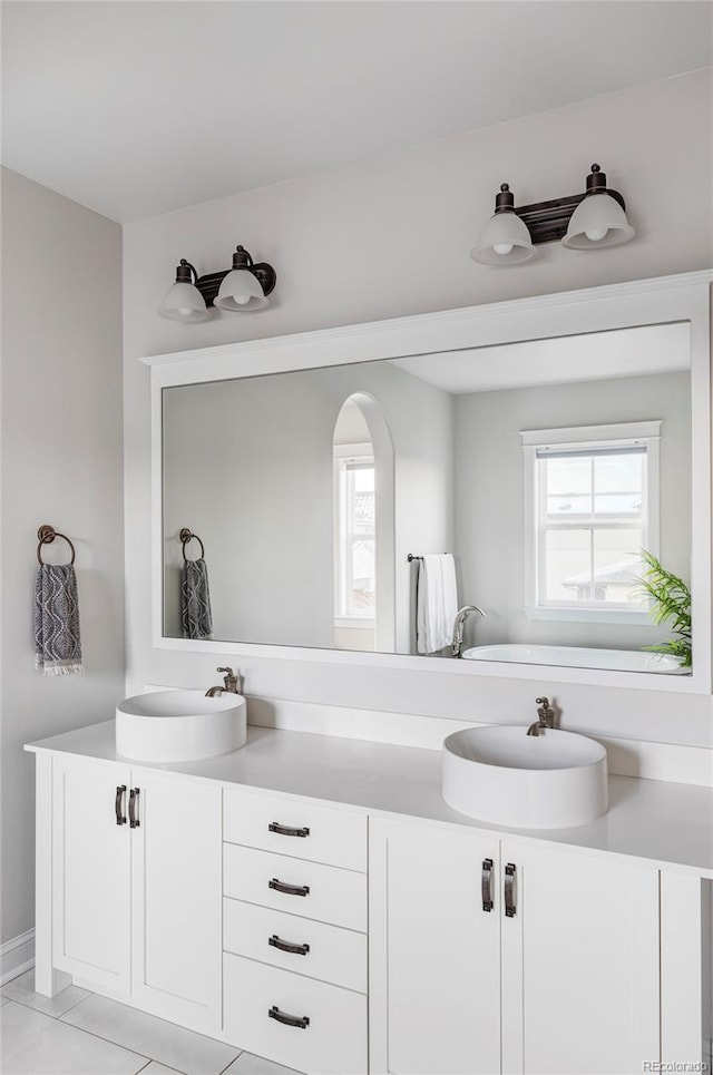 bathroom with vanity and tile patterned floors