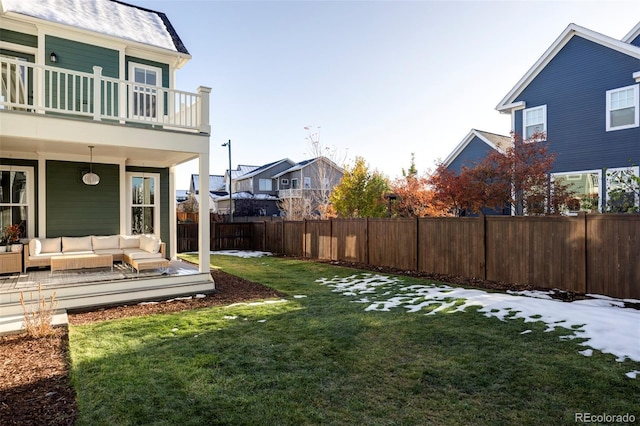 view of yard with a balcony and an outdoor hangout area