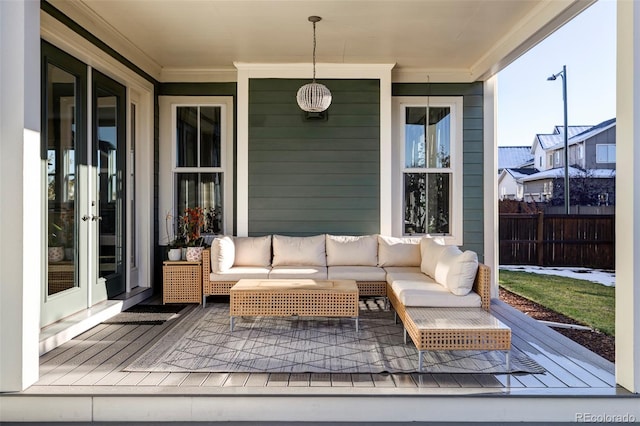 wooden deck with outdoor lounge area and french doors