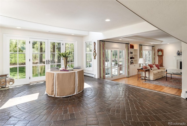 reception area featuring recessed lighting, french doors, and a fireplace