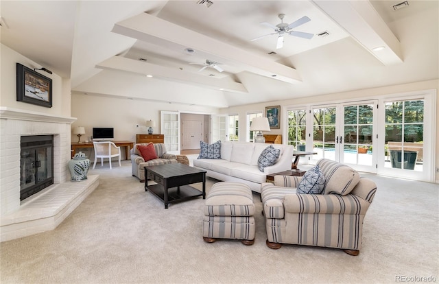 living area with french doors, light colored carpet, ceiling fan, a fireplace, and plenty of natural light