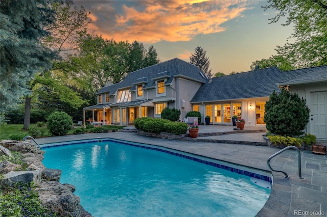 1512 Cottonwood Ln, Greenwood Village, CO 80121 - rear view of property featuring a patio area and an outdoor pool