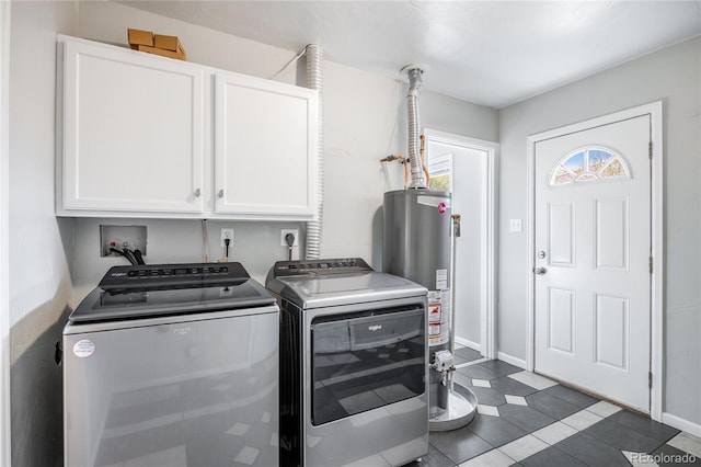 1560 Pueblo Ct, Thornton, CO 80229 - washroom with cabinet space, washing machine and dryer, water heater, baseboards, and dark tile patterned floors