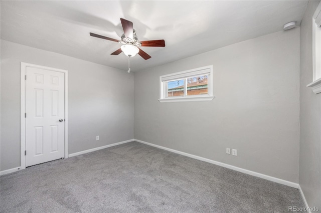 1560 Pueblo Ct, Thornton, CO 80229 - spare room featuring a ceiling fan, carpet floors, a smoke detector, and baseboards