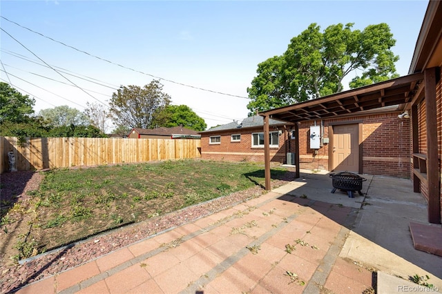 1560 Pueblo Ct, Thornton, CO 80229 - view of patio / terrace featuring a fire pit