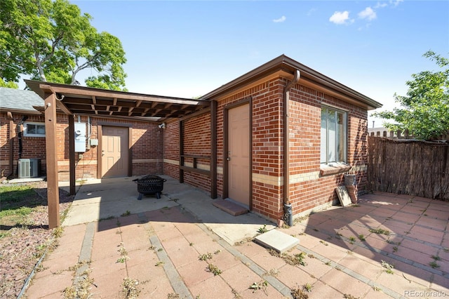 1560 Pueblo Ct, Thornton, CO 80229 - view of patio with central air condition unit and a fire pit