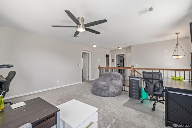 home office featuring carpet floors, baseboards, and visible vents