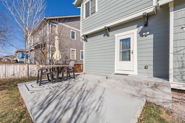 view of patio / terrace featuring fence and outdoor dining area