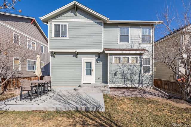 back of property featuring a patio and a fenced backyard