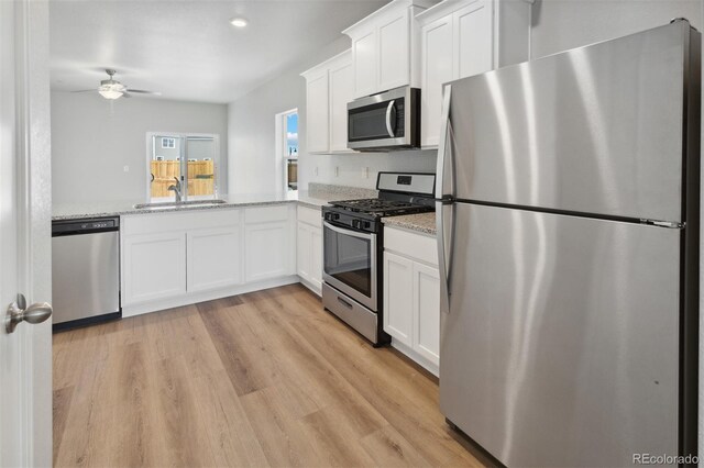 2165 Alyssa St, Fort Lupton, CO 80621 - kitchen featuring appliances with stainless steel finishes, a sink, ceiling fan, white cabinetry, and recessed lighting