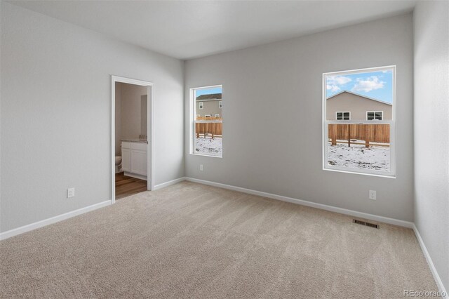 2165 Alyssa St, Fort Lupton, CO 80621 - unfurnished bedroom featuring carpet flooring, baseboards, and ensuite bath