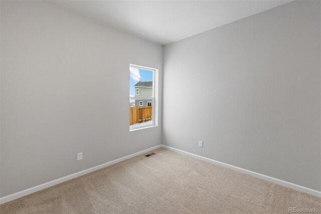2165 Alyssa St, Fort Lupton, CO 80621 - spare room with light colored carpet and baseboards