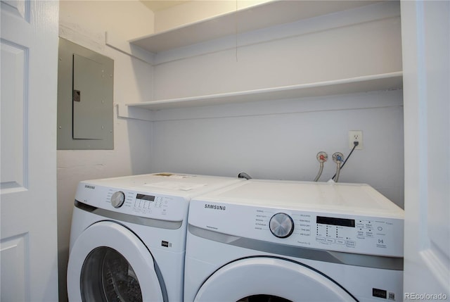 14602 E 2nd Ave Unit 100C, Aurora, CO 80011 - laundry area featuring electric panel and washer and dryer