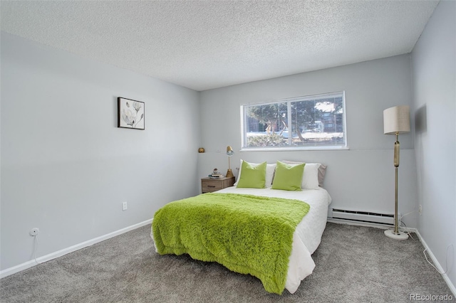 carpeted bedroom featuring a textured ceiling and a baseboard heating unit