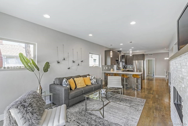 living room with dark hardwood / wood-style flooring