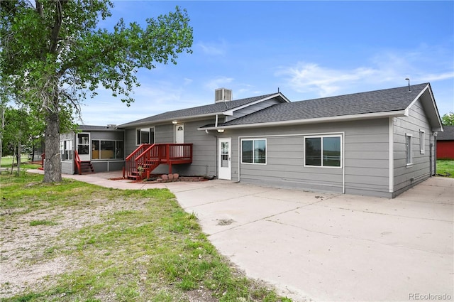 5520 Coyote Ln, Peyton, CO 80831 - rear view of house with a chimney, a shingled roof, and a patio