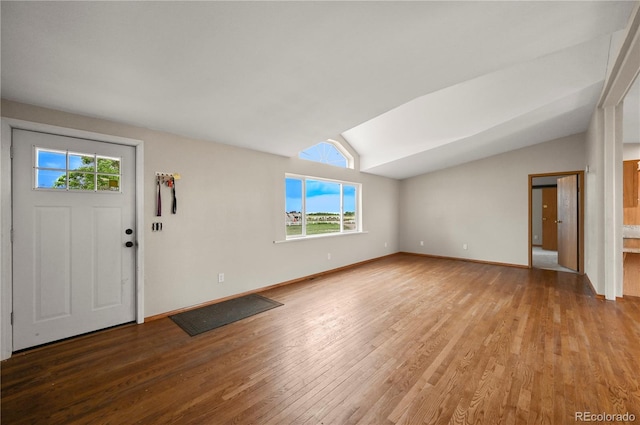 5520 Coyote Ln, Peyton, CO 80831 - foyer entrance featuring light wood finished floors, healthy amount of natural light, and vaulted ceiling