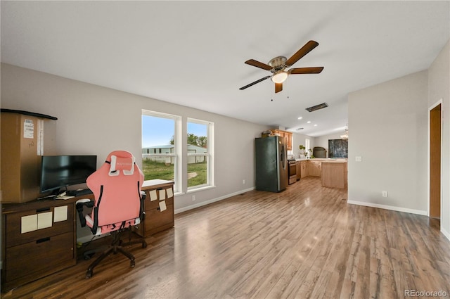 5520 Coyote Ln, Peyton, CO 80831 - living area with wood finished floors, a desk, and a ceiling fan