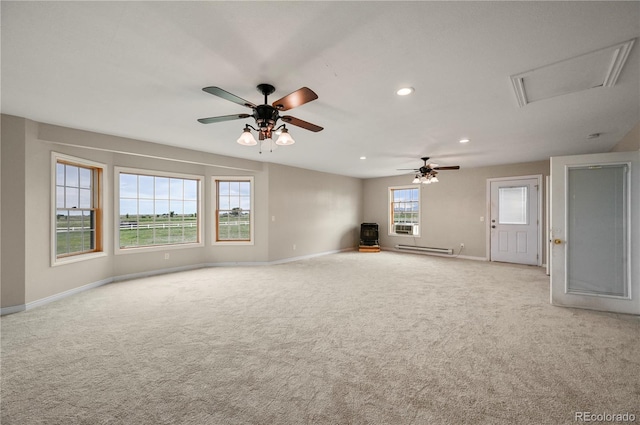 5520 Coyote Ln, Peyton, CO 80831 - spare room featuring a baseboard heating unit, light colored carpet, a ceiling fan, and recessed lighting