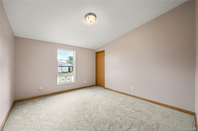5520 Coyote Ln, Peyton, CO 80831 - carpeted empty room featuring baseboards and lofted ceiling
