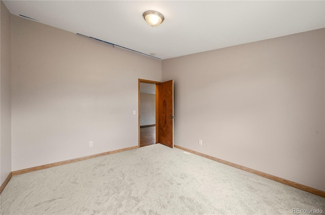 5520 Coyote Ln, Peyton, CO 80831 - carpeted empty room with baseboards