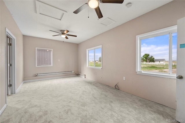 5520 Coyote Ln, Peyton, CO 80831 - carpeted spare room with attic access, a baseboard radiator, a smoke detector, and a ceiling fan