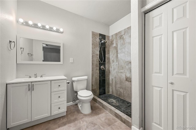 5520 Coyote Ln, Peyton, CO 80831 - bathroom with tiled shower, vanity, and a closet