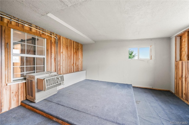 5520 Coyote Ln, Peyton, CO 80831 - empty room with carpet, a textured ceiling, and wooden walls