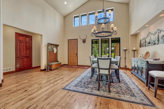 1250 Cottontail Trl, Woodland Park, CO 80863 - dining room with a chandelier, high vaulted ceiling, wood finished floors, and recessed lighting