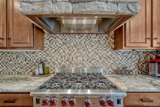 1250 Cottontail Trl, Woodland Park, CO 80863 - kitchen featuring stainless steel stove, brown cabinets, and decorative backsplash