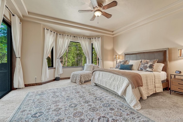1250 Cottontail Trl, Woodland Park, CO 80863 - bedroom with carpet floors, a raised ceiling, and a ceiling fan