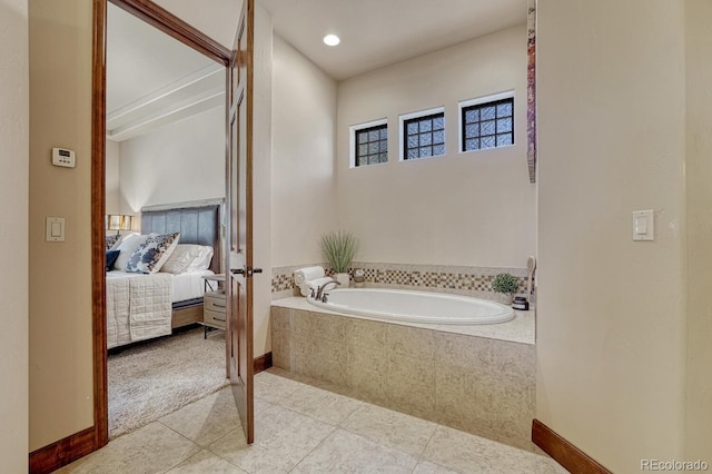 1250 Cottontail Trl, Woodland Park, CO 80863 - ensuite bathroom with a bath and tile patterned floors