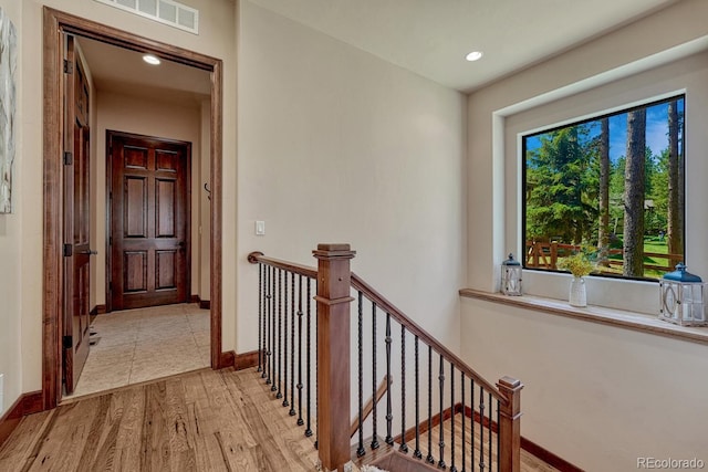 1250 Cottontail Trl, Woodland Park, CO 80863 - hallway featuring an upstairs landing, light wood finished floors, and recessed lighting