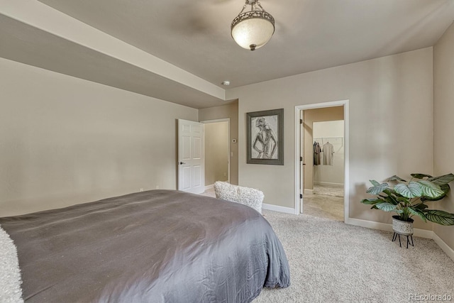 1250 Cottontail Trl, Woodland Park, CO 80863 - carpeted bedroom with baseboards and connected bathroom