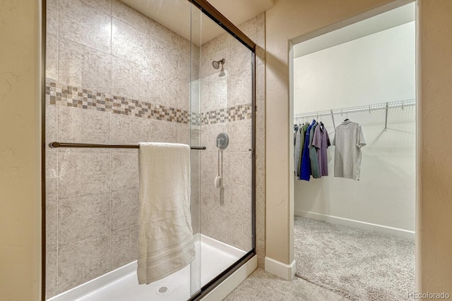 1250 Cottontail Trl, Woodland Park, CO 80863 - full bathroom featuring a shower stall and a walk in closet