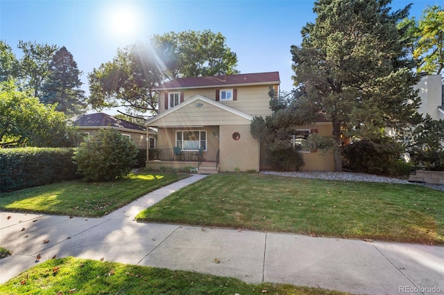 front of property with a front lawn and a porch