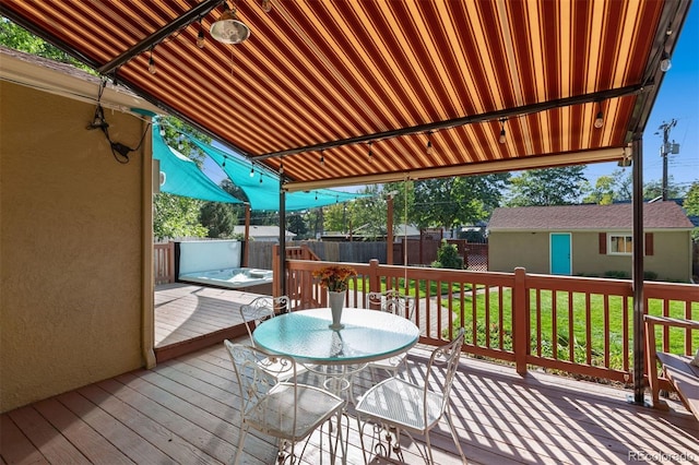 deck with a yard and an outdoor structure