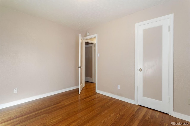 unfurnished bedroom featuring wood-type flooring