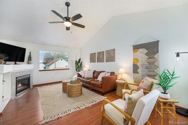 13504 Pecos St, Westminster, CO 80234 - living area featuring ceiling fan, wood finished floors, vaulted ceiling, and a fireplace