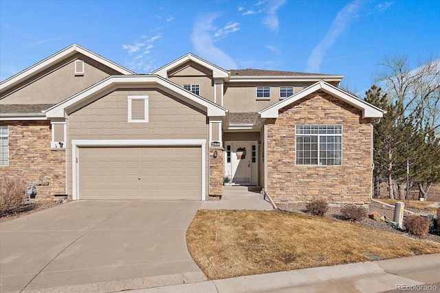 view of front of house with a garage, stone siding, driveway, and stucco siding