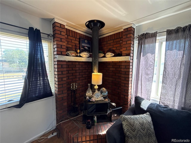 5162 W Nevada Pl, Denver, CO 80219 - living room featuring plenty of natural light, a wood stove, and wood finished floors