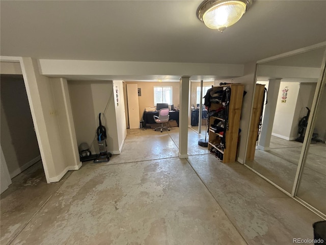5162 W Nevada Pl, Denver, CO 80219 - basement with a desk and baseboards