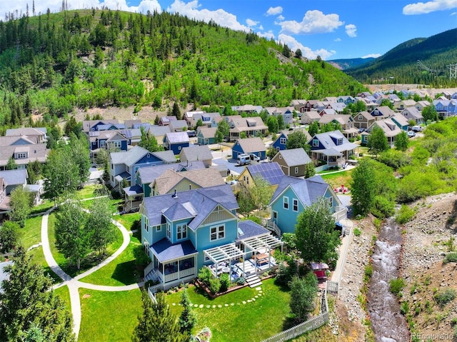 17 Meadow Lark Grn, Breckenridge, CO 80424 - aerial perspective of suburban area with a mountain backdrop and a heavily wooded area