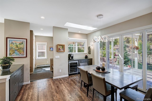 17 Meadow Lark Grn, Breckenridge, CO 80424 - dining area with wine cooler, baseboard heating, a skylight, and dark wood-style floors